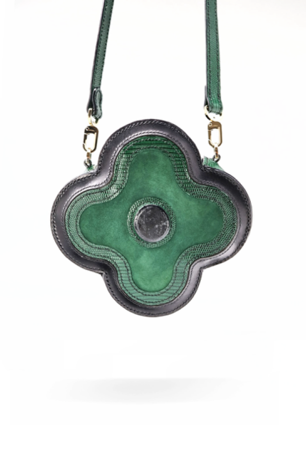 CICONIIDAE Boyciana clover-leaf handbag in Forest Green worn as crossbody — gemstone at centre, Swiss haute maroquinerie