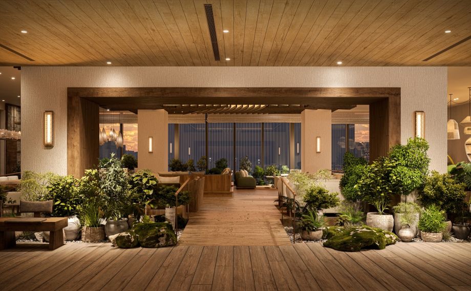 The garden lounge at 1 Hotel Tokyo, 38th floor of the Akasaka Trust Tower — mossed boulders, botanical installations and a reclaimed timber ceiling opening onto the Tokyo skyline at dusk. | Photo: 1 Hotel Tokyo