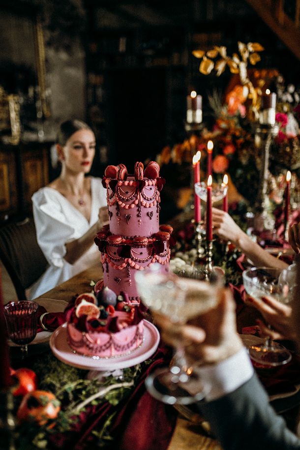 A woman with a sensual gaze posing before an opulent Dulcesserie dessert arrangement on a grand piano, capturing a living feeling of indulgence and aesthetic presence.