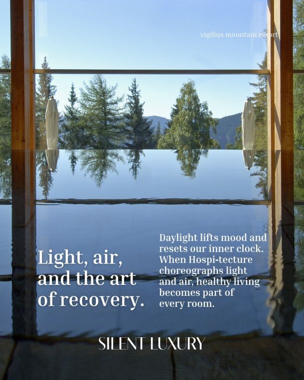 Exterior view of the Waldhotel Bürgenstock featuring terraced wooden structures and local stone gabion walls integrated into a lush Swiss mountainside forest.