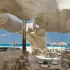 Escā Playa on Egypt's Mediterranean coast, shaped by Cairo architect Mohamed Badie. Mineral coatings and coral structures let the room read as a continuation of the shore. Photo © Nour El Refai.