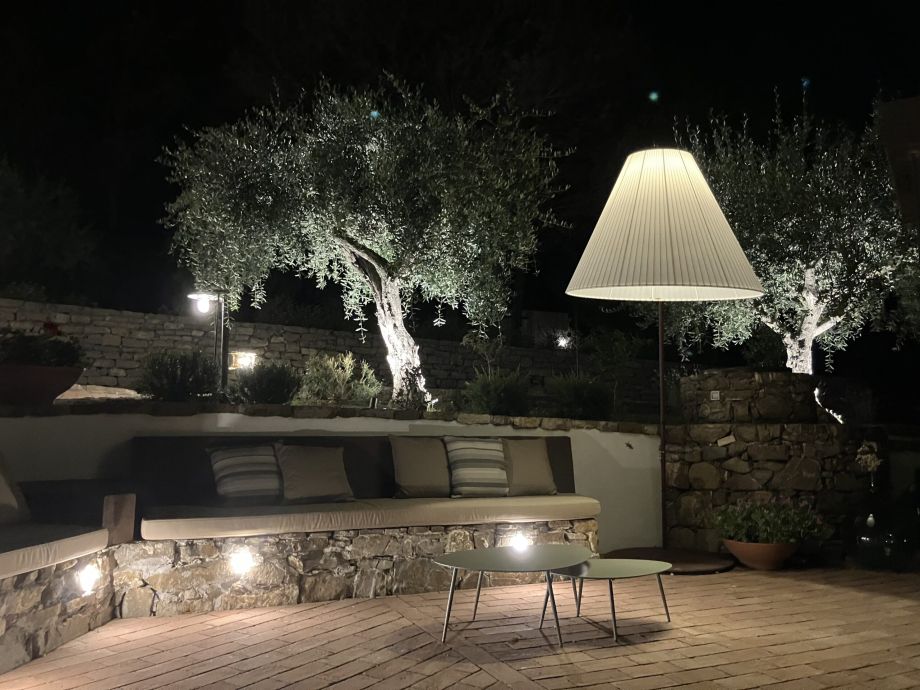 Borgo La Pietraia in Cilento at evening: the terrace where olive trees stand longer than the building itself, an example of Slow Hospitality architecture and Place Intelligence in southern Italy. | Photo: Eva Winterer