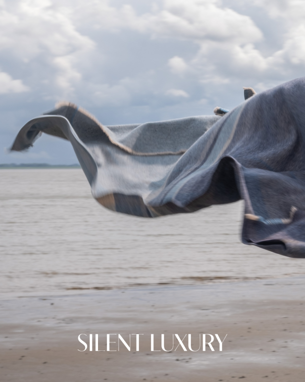 Coastland woven blanket moving in the wind by the sea