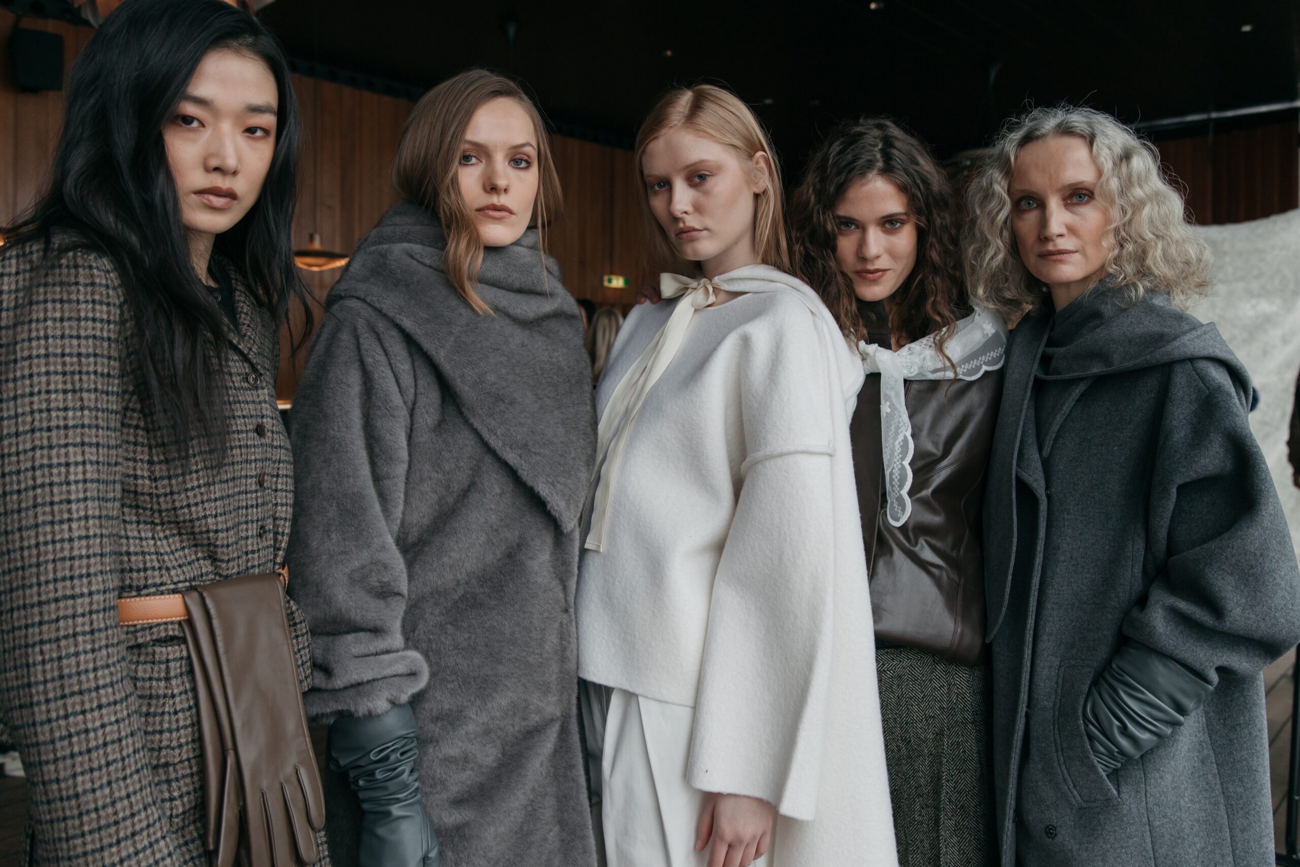 The Requirement of Obligation: Backstage at The Garment, Copenhagen Fashion Week AW26. A collective study in material depth and the persistence of craft, where the human presence remains visible inside every fold and seam. | Photo: Tonya Matyu / CPHFW.