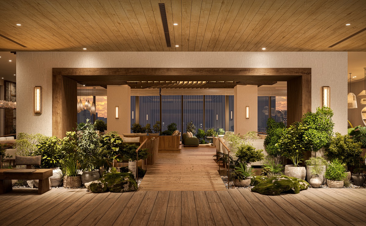 The garden lounge at 1 Hotel Tokyo, 38th floor of the Akasaka Trust Tower — mossed boulders, botanical installations and a reclaimed timber ceiling opening onto the Tokyo skyline at dusk. | Photo: 1 Hotel Tokyo