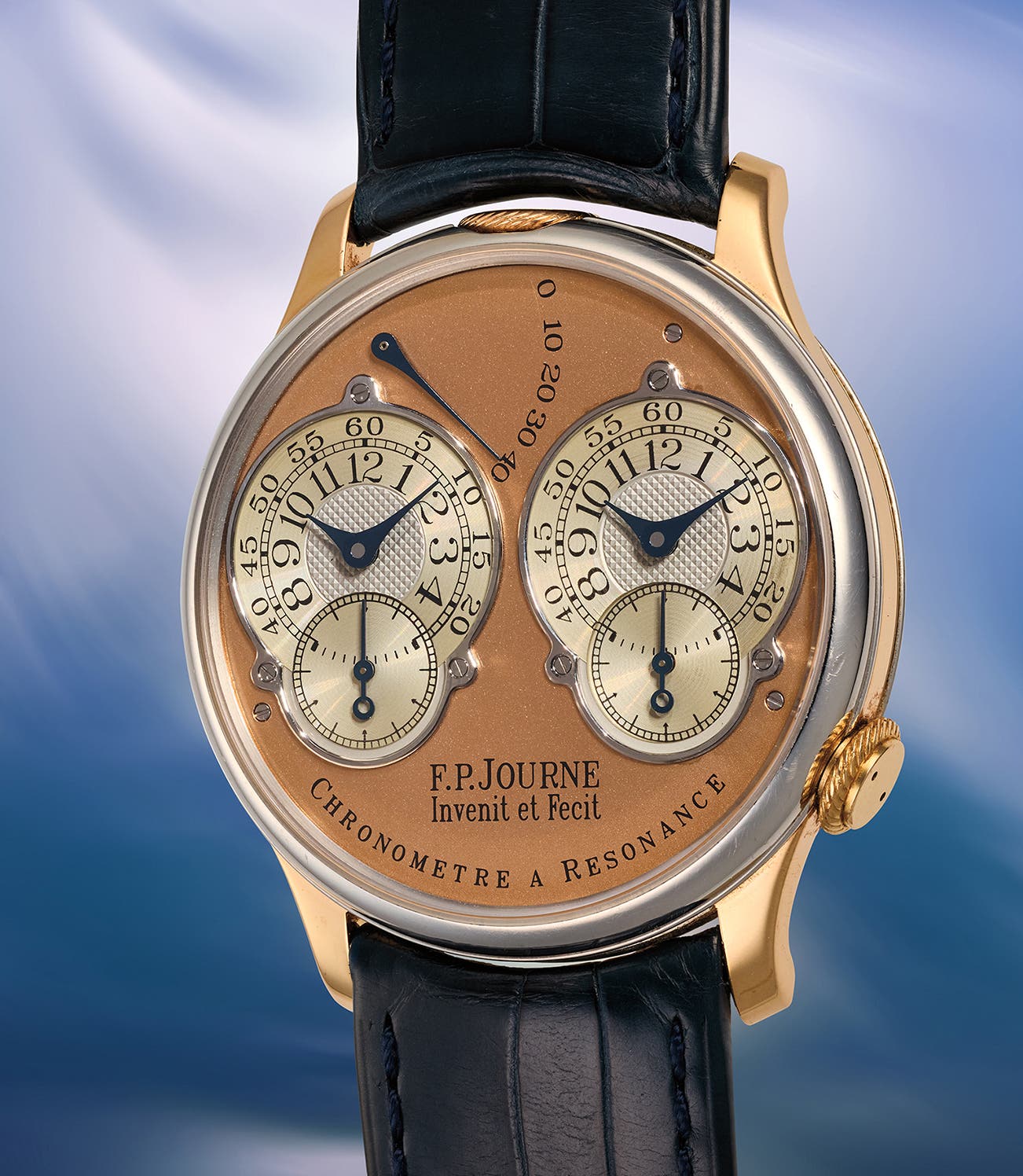 Side view of the open movement of the F.P. Journe Résonance No. 007, twin balances and gilded wheels against a striped Geneva finish