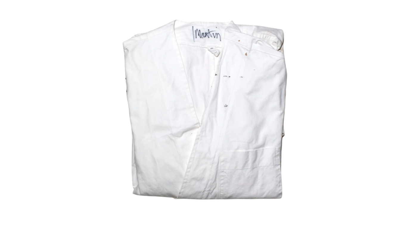 Lot 16, the white studio coat Martin Margiela wore in his atelier, signed "Martin" at the collar. Est. €6,000–10,000. Courtesy of Maurice Auction & Kerry Taylor Auctions