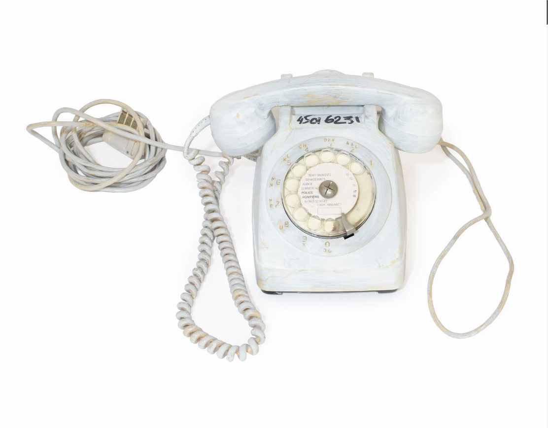 White-painted rotary telephone from Martin Margiela's studio, his number in black marker, lot 17