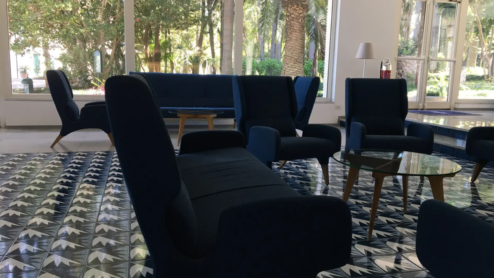 The lobby of the Parco dei Principi in Sorrento, opened in 1962. Gio Ponti designed thirty majolica tile patterns for the hotel, and no two repeat. The chairs kept the cobalt he borrowed from the gulf outside. | Photo: Eva Winterer