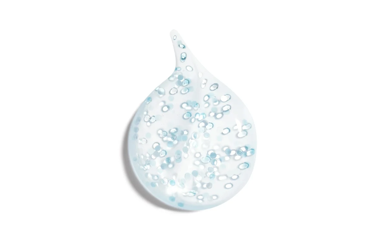 A drop of Chanel Hydra Beauty Micro Sérum with visible micro-droplets that keep the camellia active ingredient apart until application.