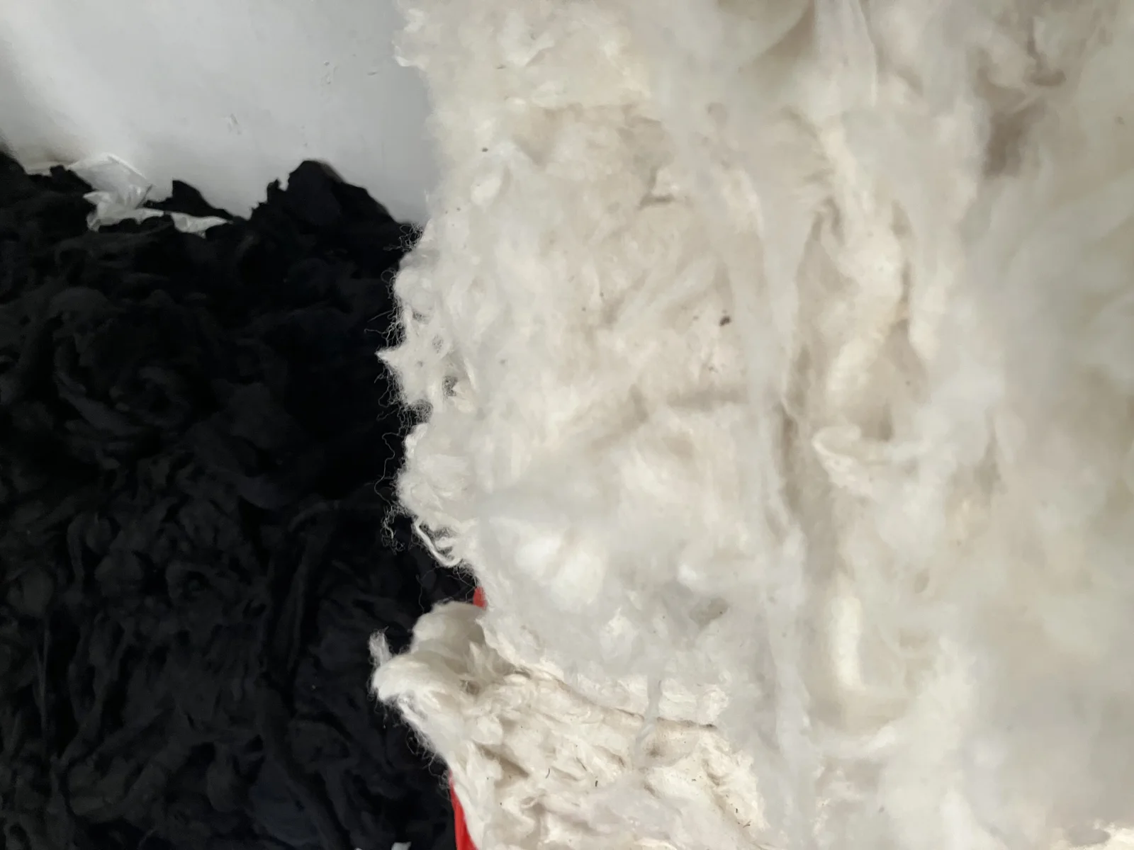 Undyed black and white raw wool, waiting to be blended.