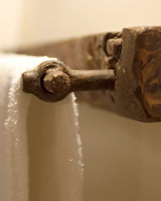 The Albergo Diffuso approach to restoration preserves original materials and fittings as part of the hospitality experience. At Sextantio in Santo Stefano di Sessanio, a centuries-old wooden towel rail remains in place — the kind of provenance that cannot be sourced, only inherited. This is what Giancarlo Dall'Ara means when he describes the Albergo Diffuso as a place where guests become temporary residents rather than tourists. Photo: Courtesy Sextantio