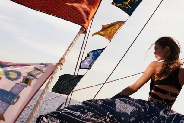 Silk carrés as signal flags in the Hermès spring-summer 2026 campaign, from the image material published with the 2026 first-half results, presented in Paris on 29 July 2026. | In courtesy of Hermès International
