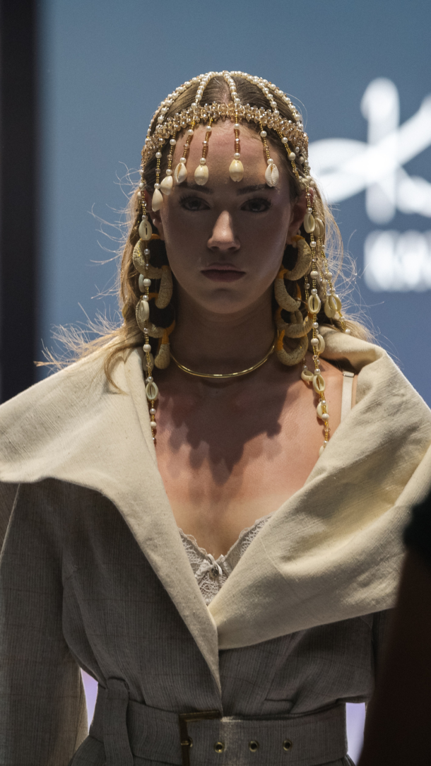 Naaniya at the eighth edition: a French designer of Malian heritage layering Bogolan and West African ornament into European tailoring.