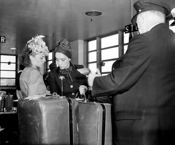 Elsa Schiaparelli, right, clears customs at the New York seaplane base on arrival aboard the Dixie Clipper, 25 May 1941, met by her daughter Gogo. | Credit: APA-Images / AP.