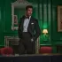 British model David Gandy in a black dinner suit from Hackett Nº14 Savile Row in a green panelled room. Courtesy of Hackett London