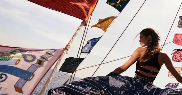 Silk carrés as signal flags in the Hermès spring-summer 2026 campaign, from the image material published with the 2026 first-half results, presented in Paris on 29 July 2026. | In courtesy of Hermès International