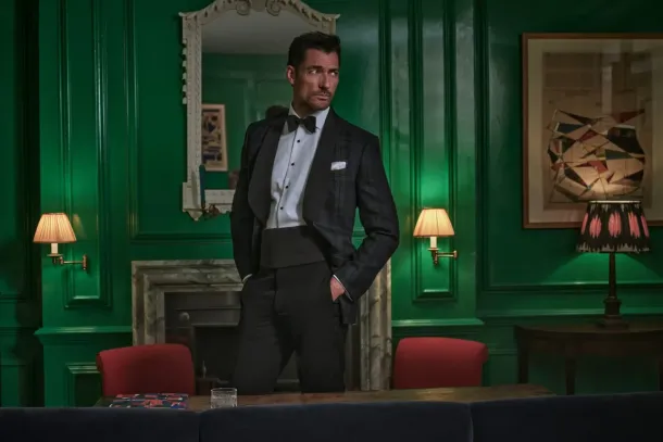 British model David Gandy in a black dinner suit from Hackett Nº14 Savile Row in a green panelled room. Courtesy of Hackett London