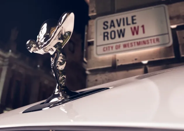 The bonnet figure of the one-of-one Ghost Savile Row in front of the street that gave the word bespoke its meaning. | In Courtesy of Rolls-Royce Motor Cars