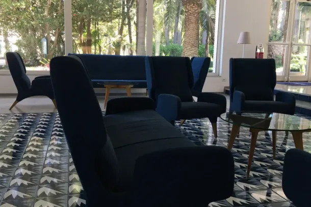 The lobby of the Parco dei Principi in Sorrento, opened in 1962. Gio Ponti designed thirty majolica tile patterns for the hotel, and no two repeat. The chairs kept the cobalt he borrowed from the gulf outside. | Photo: Eva Winterer